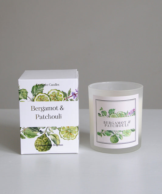 Bergamot & Patchouli candle and packaging on a gray background