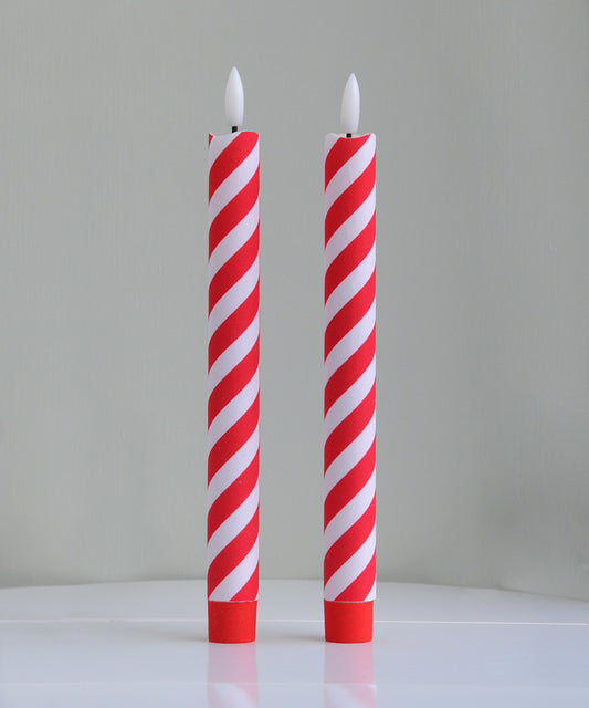 Two red and white striped candles 