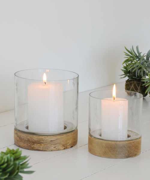 Glass votive with pillar candles