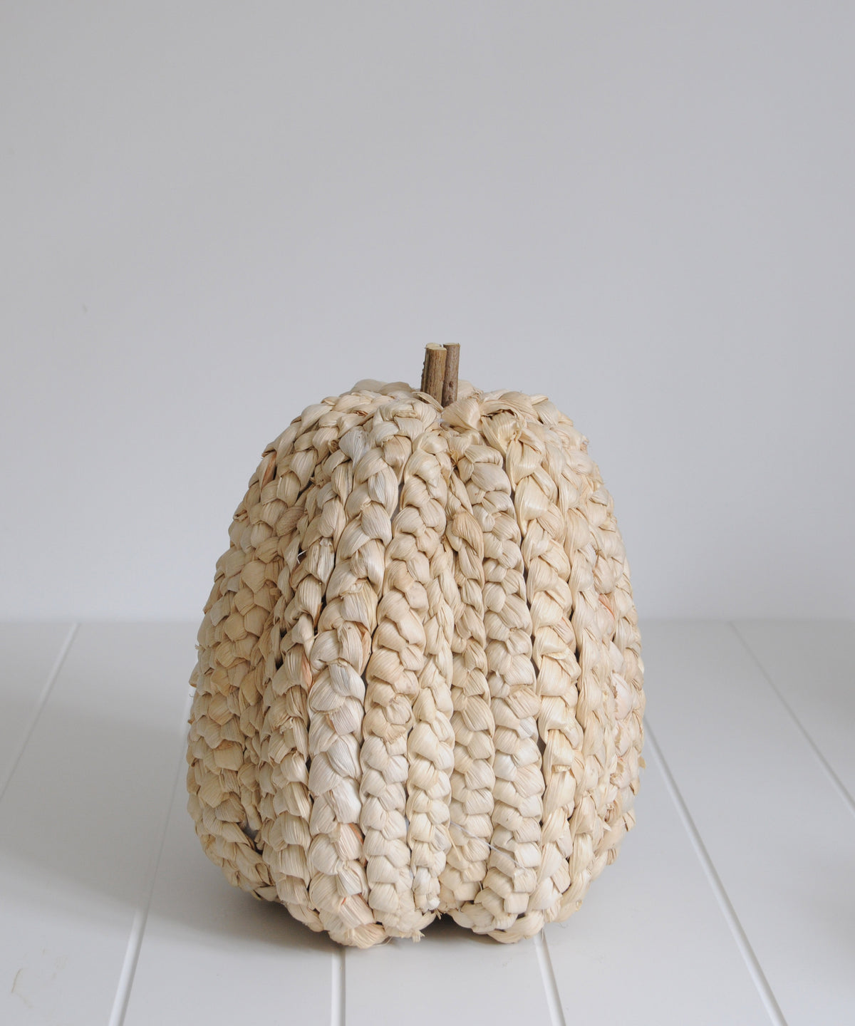 Tall straw pumpkin